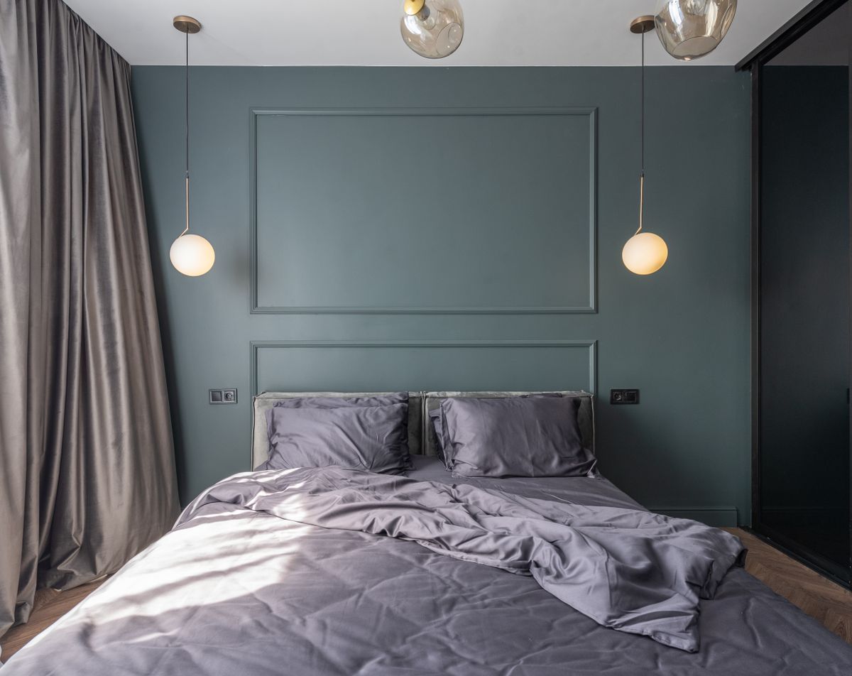 A modern bedroom with a neatly made bed